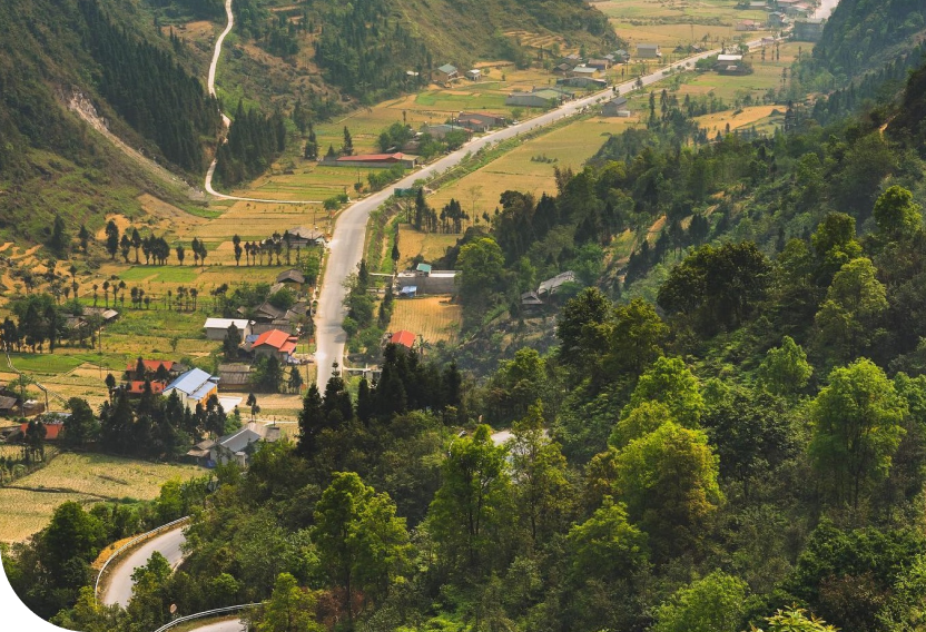 A winding road through a Ha Giang valley